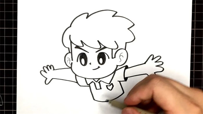 教你画一个踢足球的小男孩简笔画