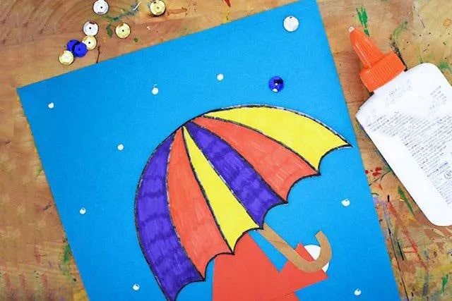 幼儿创意下雨天手工：拼贴画撑着伞的小女孩