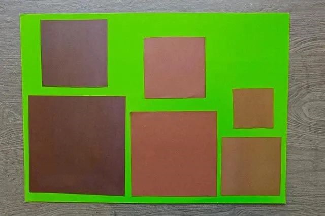 折纸拼贴画在森林里散步的小熊一家