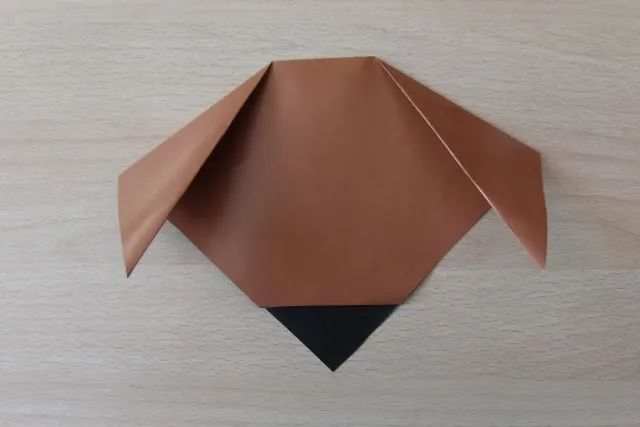 幼儿折纸手工简单小动物：怎么折纸坐着的小狗