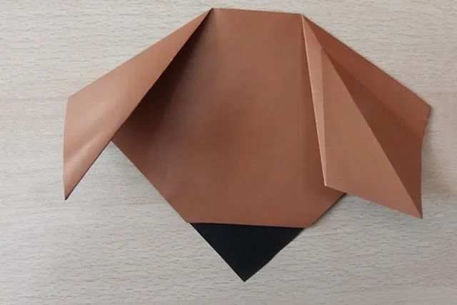 幼儿折纸手工简单小动物：怎么折纸坐着的小狗