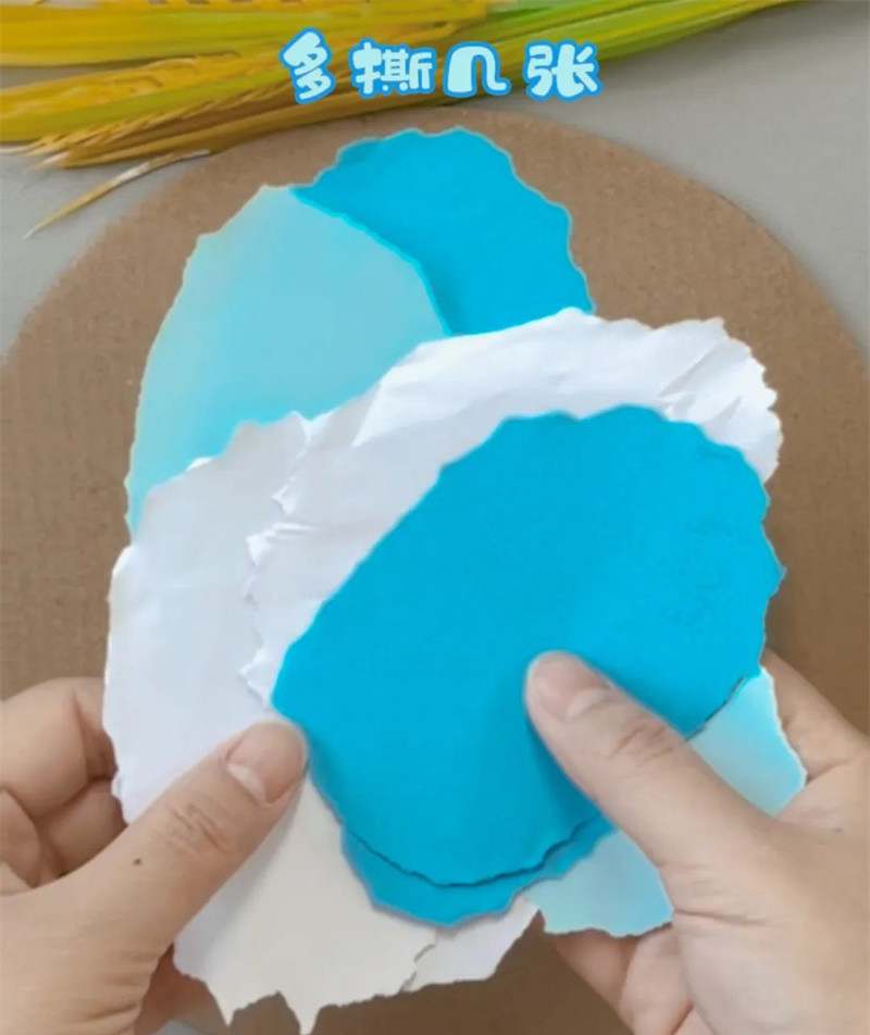 手工撕纸拼贴画《冬日的树林》